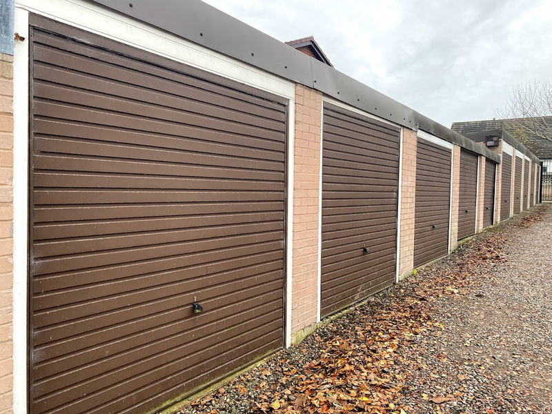parade of lock up garages with brown doors