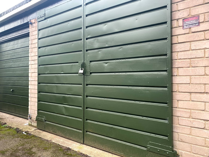 lock up garage with green metal doors